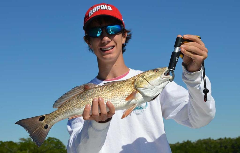 Happy Angler With His First Fort Myers Redfish