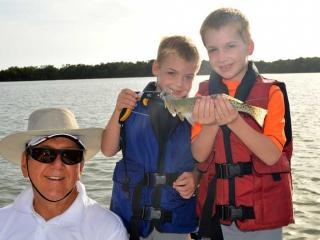Grandpa Fishing With His Grand Kids In Fort Myers